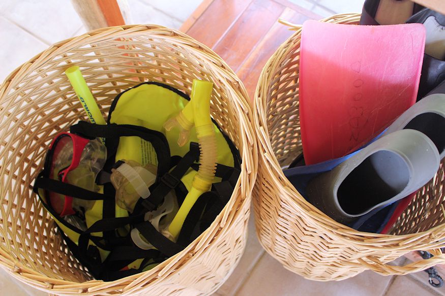 Snorkeling gear and fins in basket
